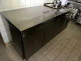 a kitchen with a sink, stove, and a dishwasher