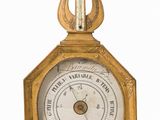 une vieille horloge avec un cadre doré et un pendule