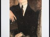 portrait of a man in a black suit and hat holding a book