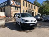 a white van parked in front of a building