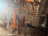 an image of a machine that is working on a piece of machinery