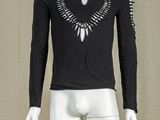 a mannequin wearing a black shirt with a bird design