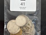 a bag of coins sitting on top of a table