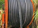 a hose that is connected to a pipe in the grass