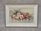 un tableau représentant des roses, encadré de blanc, accroché au mur
