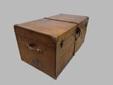 an old brown suitcase with a handle on a gray background