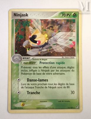 a close up of a pokemon card on a white surface