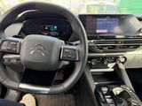 the interior of a car with a steering wheel and a dash board