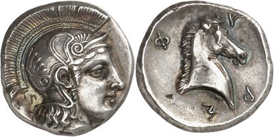 a close up of a silver coin with a horse on it
