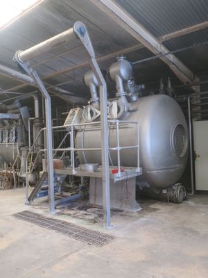 a large metal tank sitting inside of a building