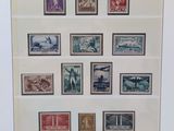 framed picture of a collection of stamps from around the world