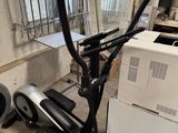 an image of a stationary exercise bike in a garage