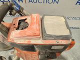 an image of a chainsaw with a filter attached to it
