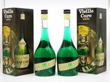 three bottles of wine sitting next to each other in front of a box