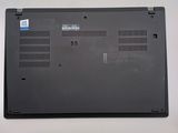 a black laptop with a blue sticker on the back of it