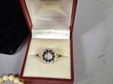 a ring in a box with a bead around it
