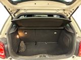 the back of a car with the trunk open and a bag in the trunk