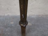 an image of a close up of a table with a vase on it