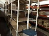 many shelves with boxes and bins in a warehouse