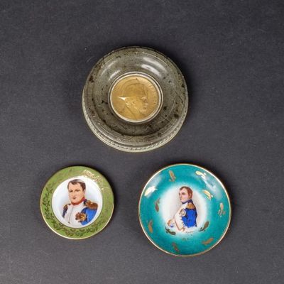 three small plates with pictures of people on them on a table