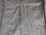 a close up of a shirt with buttons on it