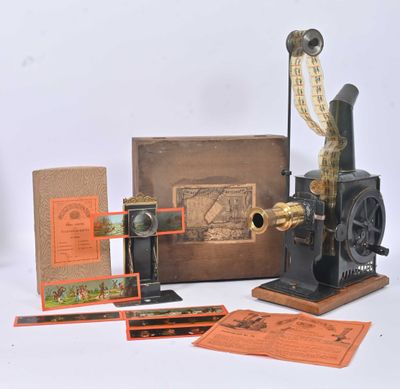 an old fashioned sewing machine with a box and papers on a table