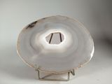 a picture of a white agate with a hole in it