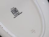 a white plate with a black and white design on it