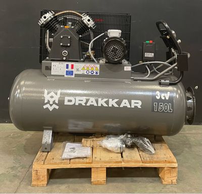 a close up of a compressor on a pallet in a warehouse