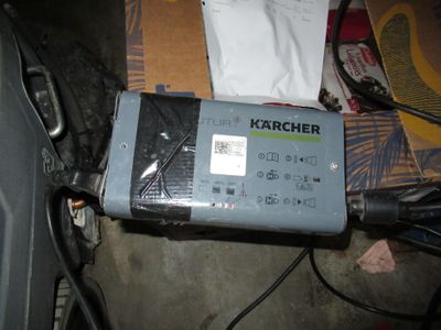 an image of a car battery charger on a table