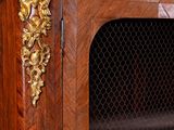 an antique wooden cabinet with a marble top and a lion head on the front