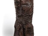 sculpture of a woman in a dress made of wood on a white background