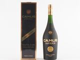 a bottle of camus marmelon next to a cardboard box