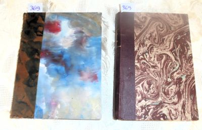 two notebooks that are sitting on a table