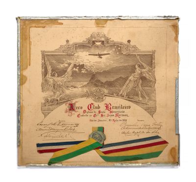 an old document with a ribbon and a medal on it