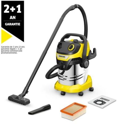 un aspirateur jaune et noir à côté d'une éponge de nettoyage