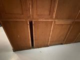 an image of a wooden cabinet with a hole in it