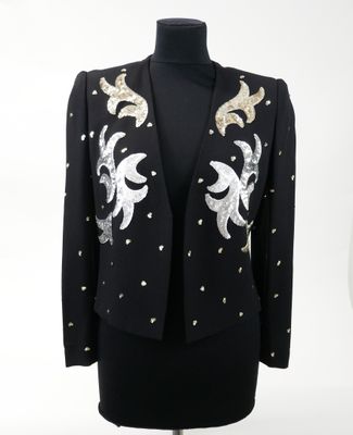 a black jacket with gold and silver sequins on it