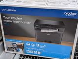 a black and white photo of a printer in a box