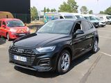 a black audi suv parked in a parking lot