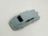 a toy car that is sitting on a white surface