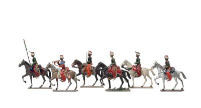 cinq figurines représentant des hommes à cheval, avec des drapeaux