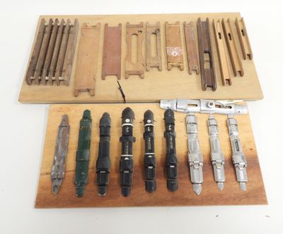many different types of tools on a wooden board