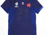 a blue shirt with a picture of a rooster on it