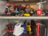 many different tools on the shelf in the cabinet