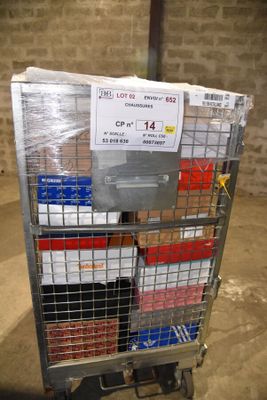 a metal cart with a bunch of boxes on it