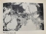 a black and white photo of an aerial view of a city