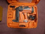 an orange case with a stapler and a stapler in it