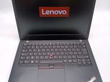lenovo laptop with a red lenovo sticker on the screen