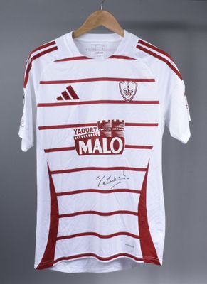 a white shirt with a red and white stripe on it